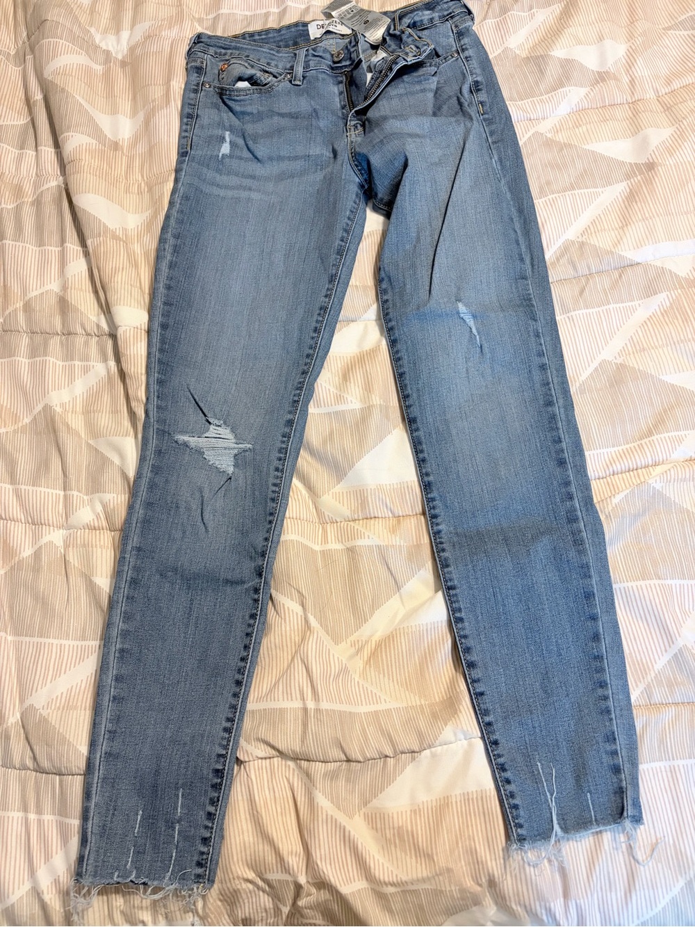 Denizen from Levi's Light Wash Distressed Skinny Jeans
